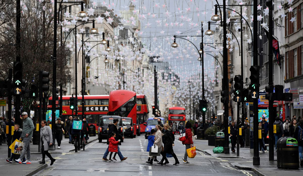 Shoppers cross Oxford Street